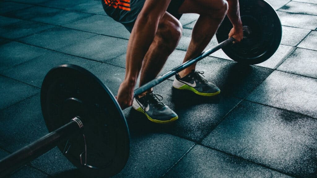 man lifting weights