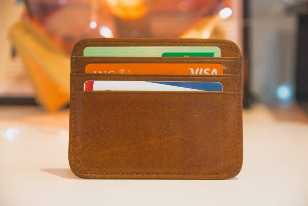 brown wallet with credit cards partially seen